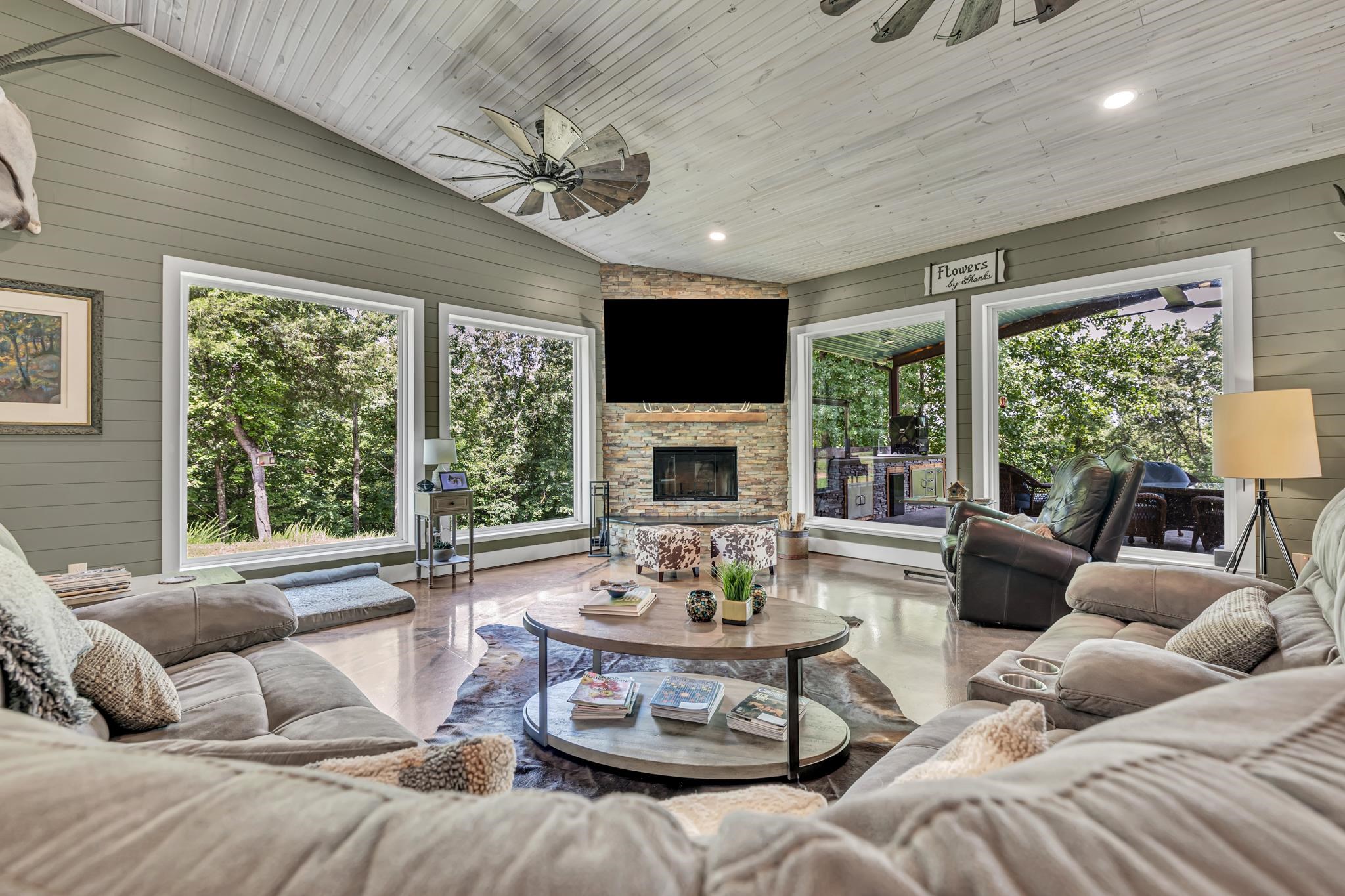 350 Hamilton Road Springville, TN 38256 - Photo 16 of 40 Vaulted ceiling with wood-finish planks and a decorative ceiling fan