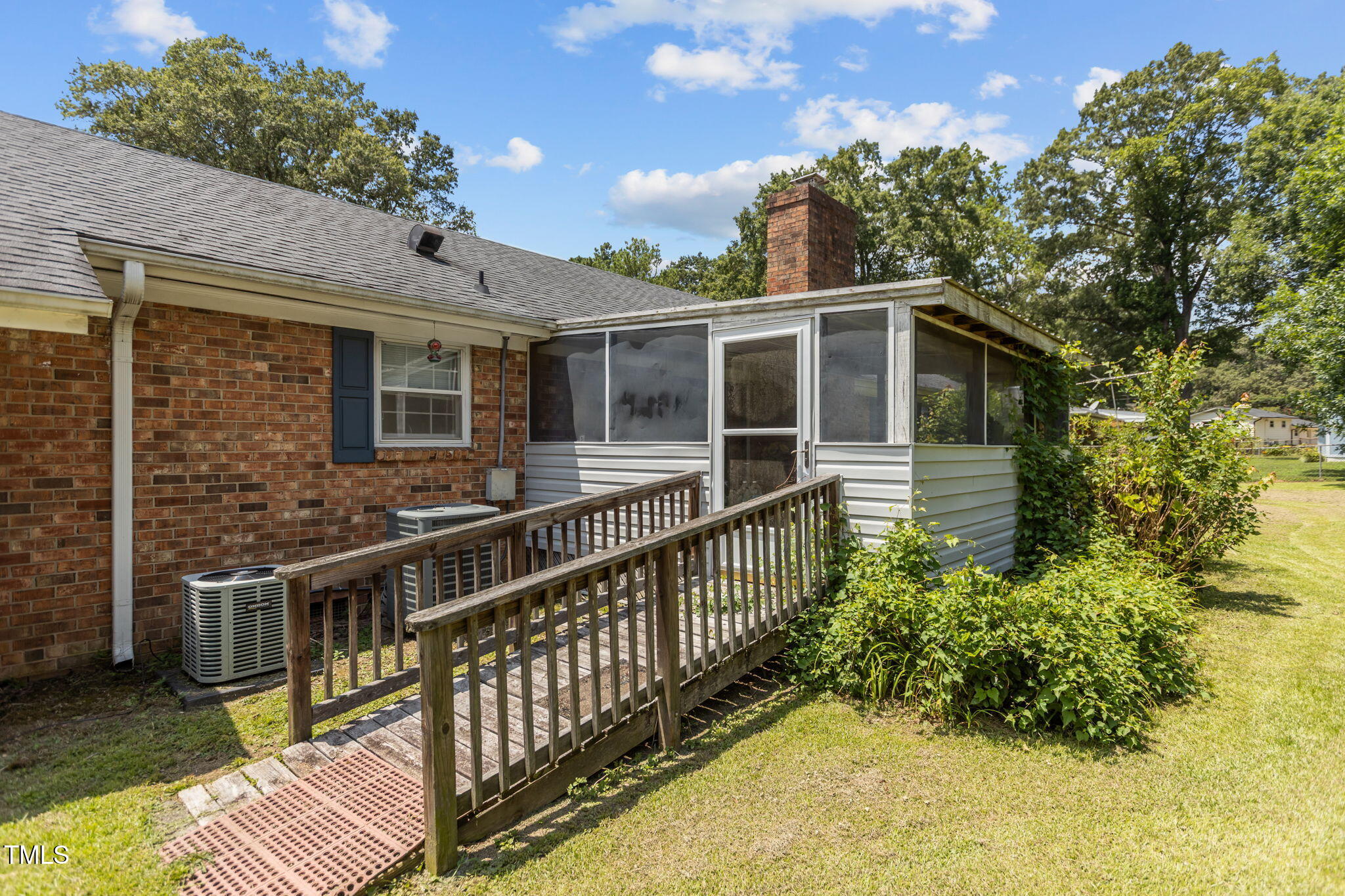 4807 Greenbrier Road Raleigh, NC 27603 - Photo 29 of 40 a front view of a house with a garden