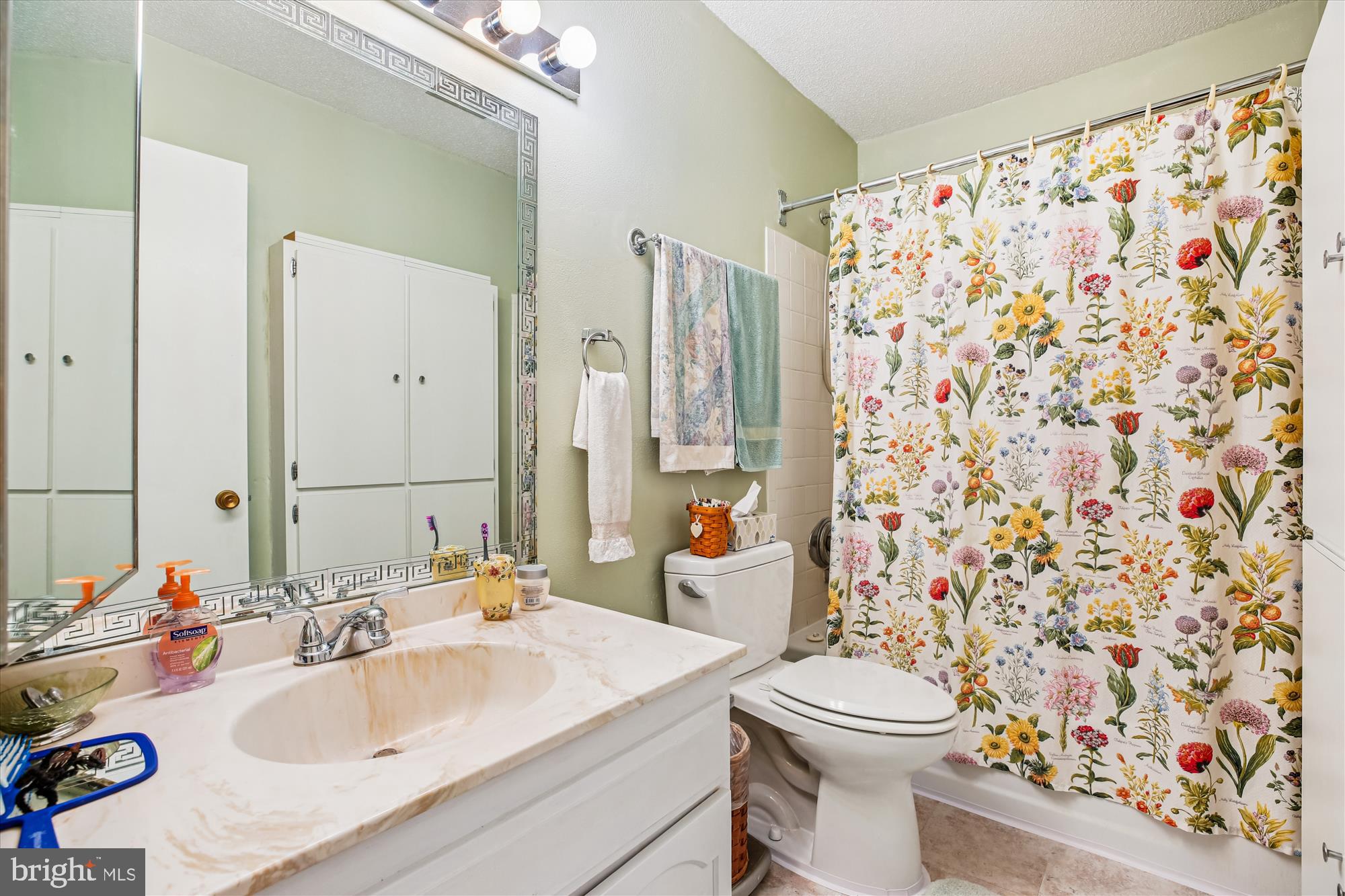 15205 Tottenham Terrace, Unit 24B Silver Spring, MD 20906 - Photo 10 of 33 a bathroom with a sink toilet and shower