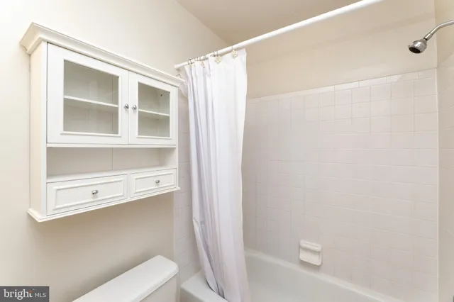 a view of an empty room with a fireplace