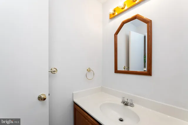 a view of an empty room with a fireplace