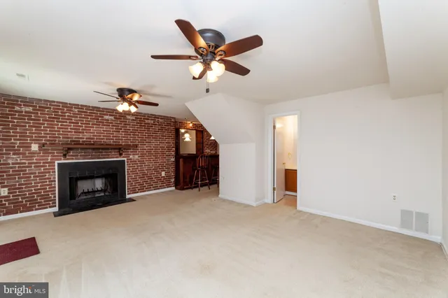 a dinning room with a table chairs and entryway