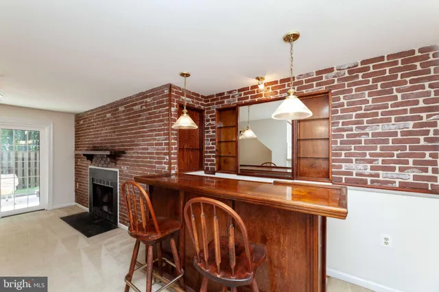 a view of balcony with wooden floor and fence