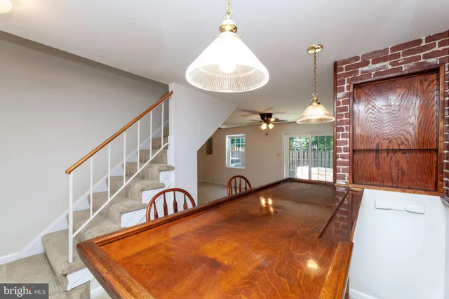 a view of a house with wooden floor and wooden fence
