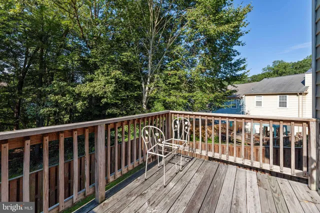 a view of a backyard with a small cabin and wooden fence