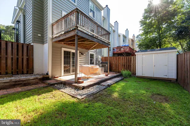 a front view of house with a garden