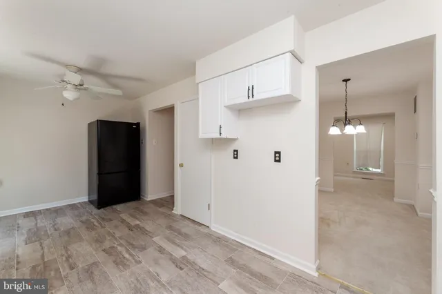 a kitchen with a sink cabinets appliances and a window