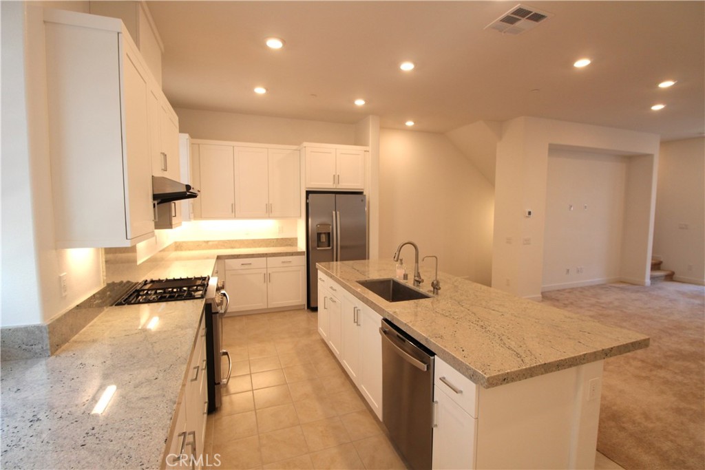 398 Merit Irvine, CA 92618 - Photo 12 of 25 a kitchen with a sink appliances and cabinets