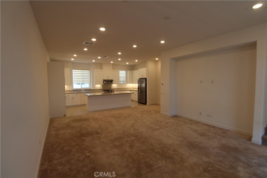 398 Merit Irvine, CA 92618 - Photo 15 of 25 a view of empty room with kitchen and window