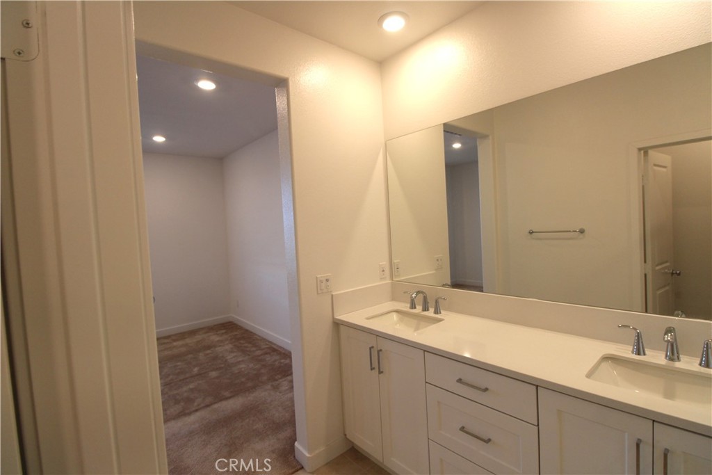 398 Merit Irvine, CA 92618 - Photo 19 of 25 a bathroom with a sink and a mirror