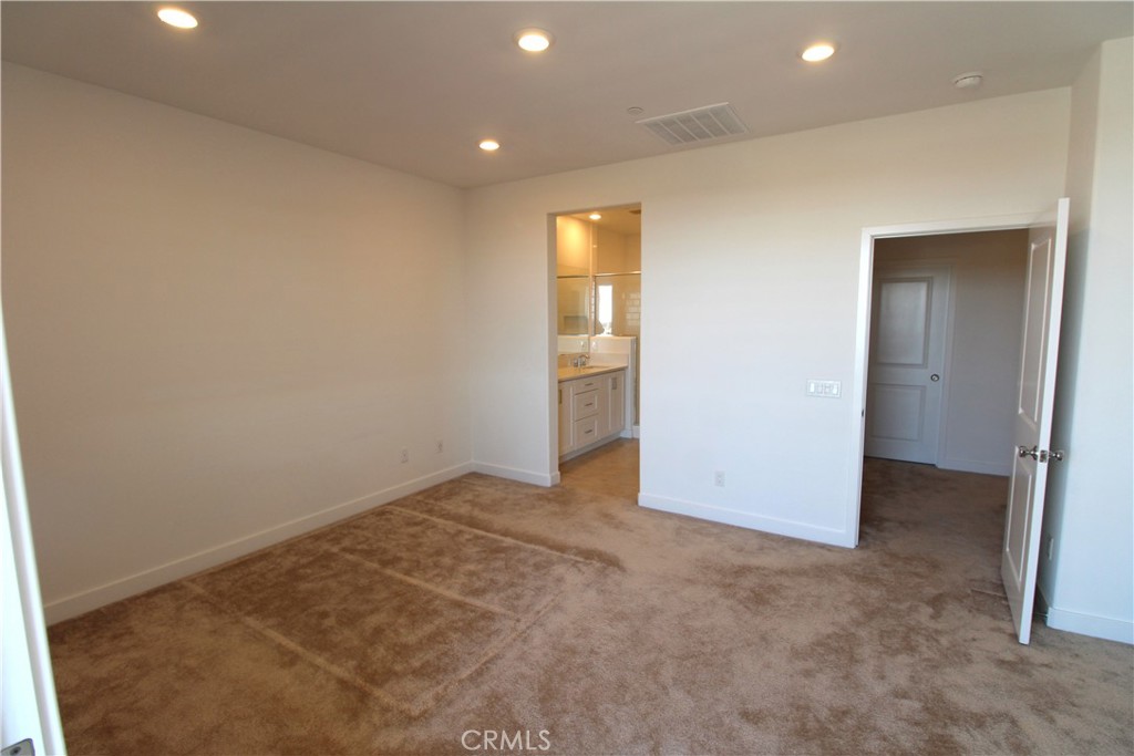 398 Merit Irvine, CA 92618 - Photo 21 of 25 an empty room with closet and windows
