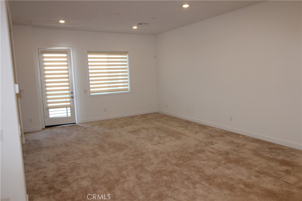 398 Merit Irvine, CA 92618 - Photo 9 of 25 an empty room with windows