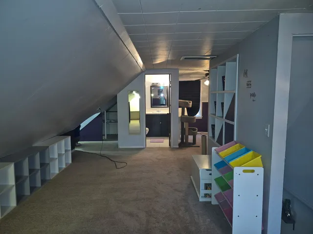 a view of hallway with furniture and toys