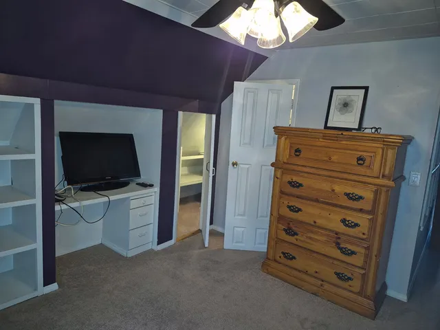 a view of room with furniture and a flat screen tv