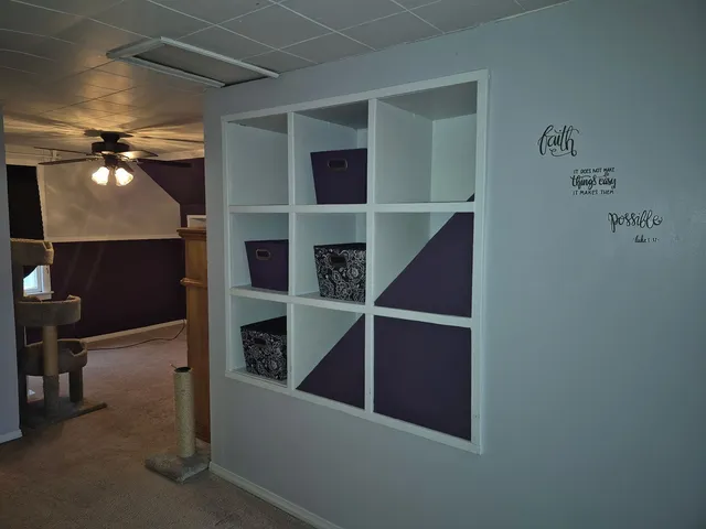 a view of an empty room with closet