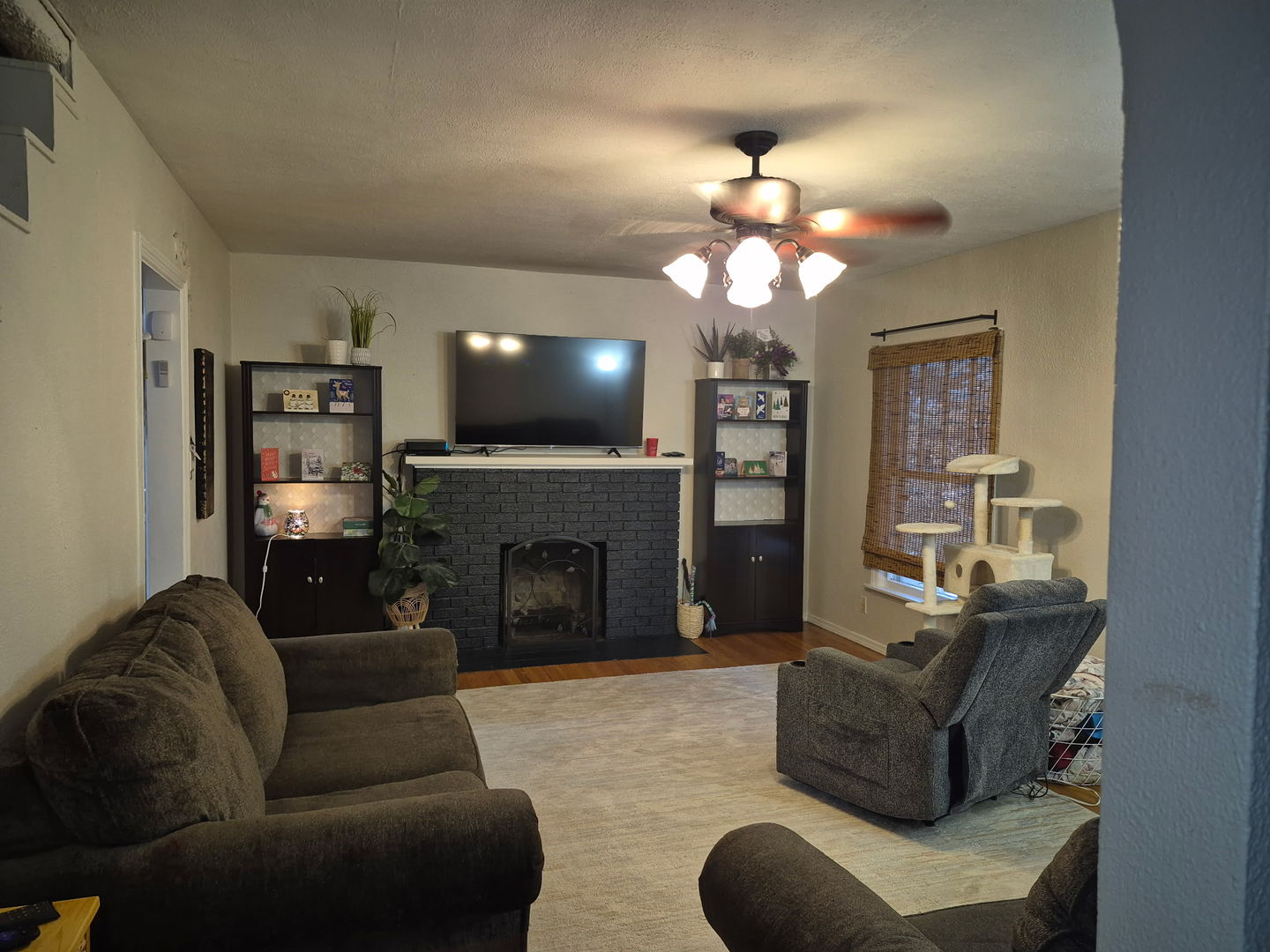 863 West Williams Street Kankakee, IL 60901 - Photo 3 of 14 a living room with furniture a fireplace and a flat screen tv