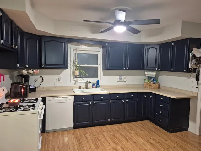 a kitchen with a sink and cabinets