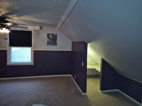 a view of an empty room with windows