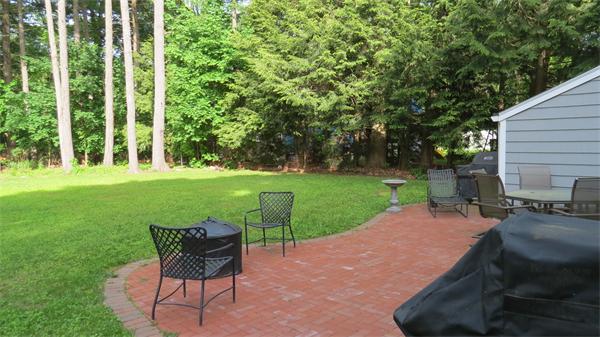 23 Hadley Road Framingham, MA 01701 - Photo 8 of 22 a view of a backyard with sitting area