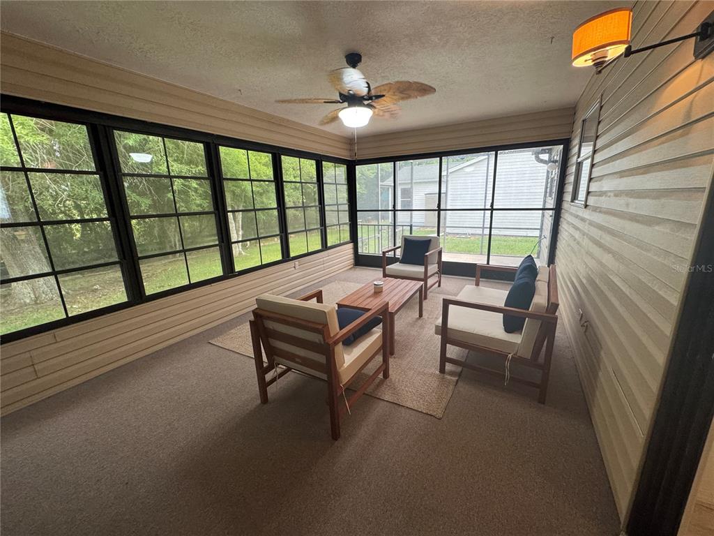 314 Juarez Way Lady Lake, FL 32159 - Photo 14 of 17 a living room with furniture and a large window