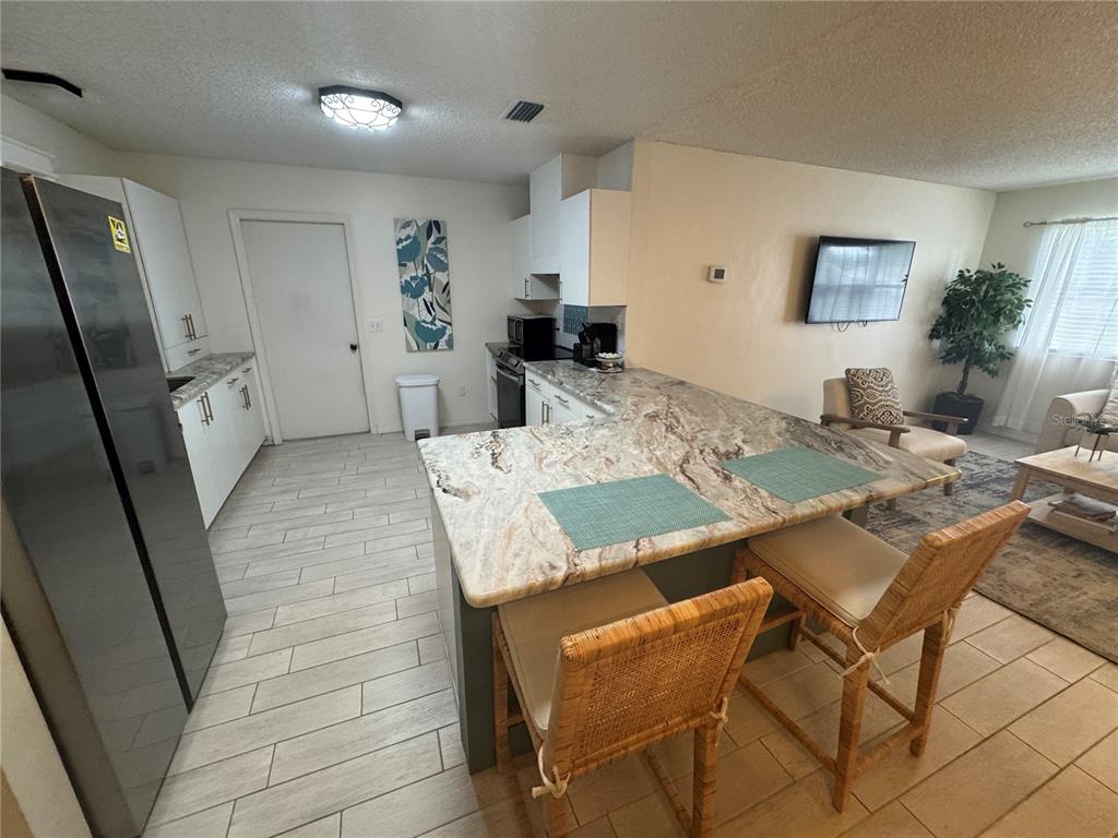 314 Juarez Way Lady Lake, FL 32159 - Photo 5 of 17 a view of a dining room with furniture