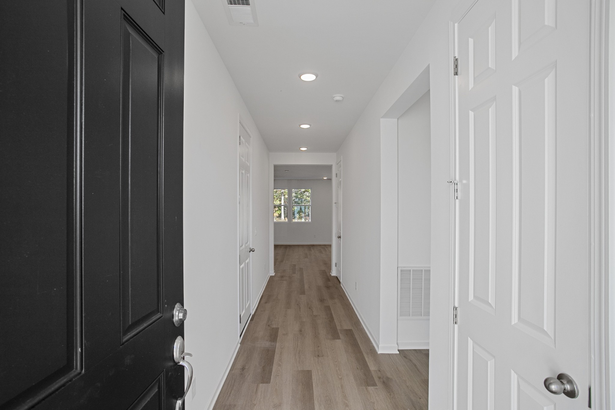 702 West Chestnut Street Dickson, TN 37055 - Photo 2 of 37 a view of a hallway with wooden floor