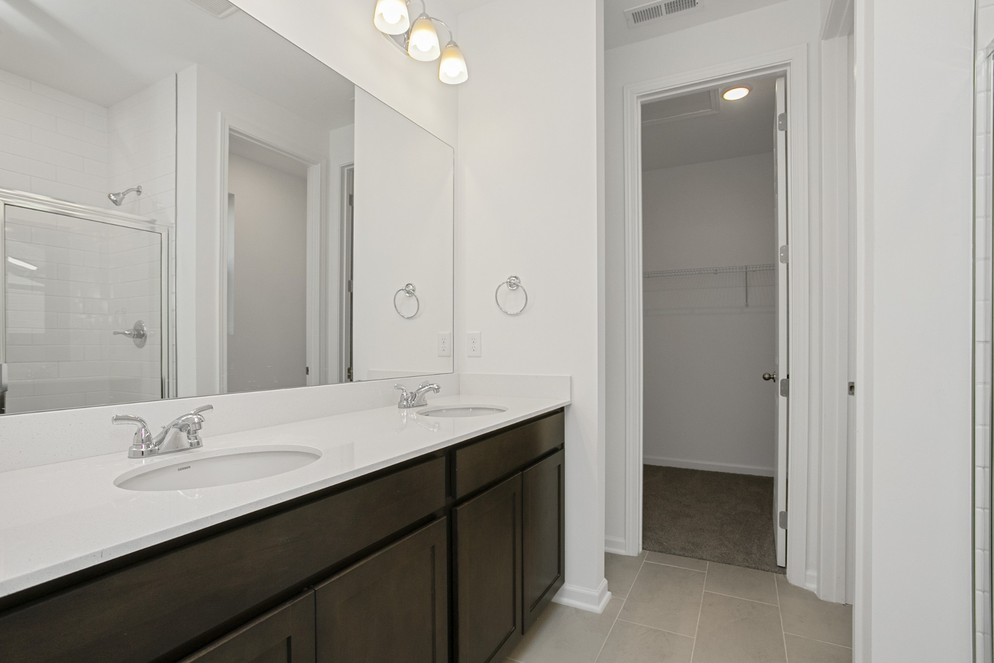 702 West Chestnut Street Dickson, TN 37055 - Photo 28 of 37 a bathroom with a sink double vanity and a mirror