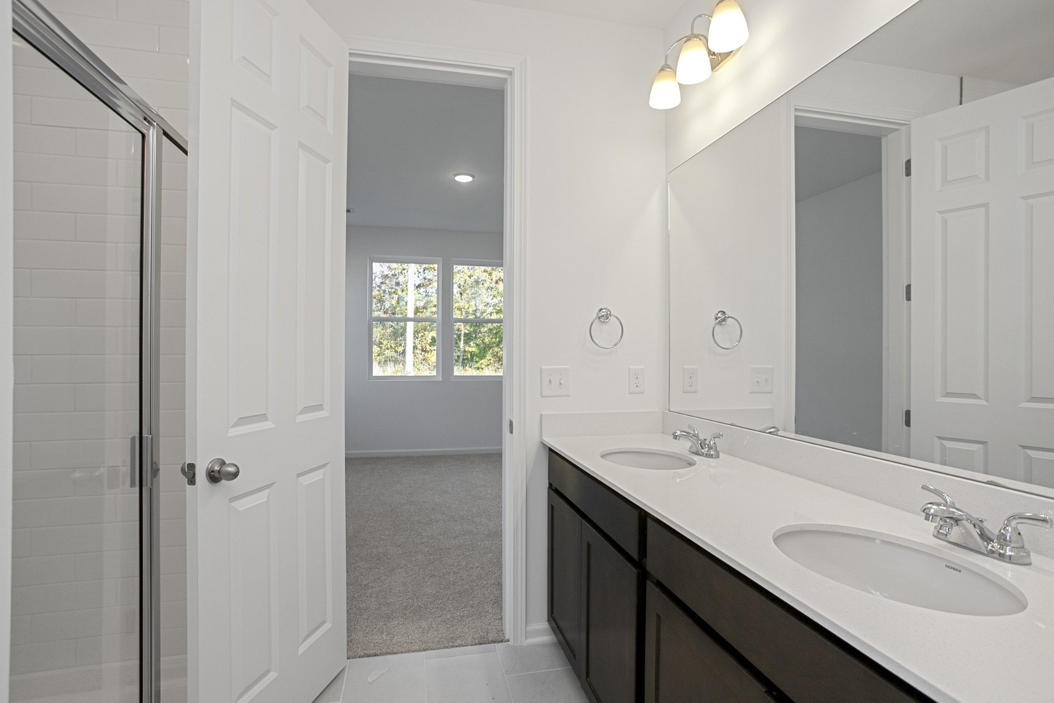 702 West Chestnut Street Dickson, TN 37055 - Photo 30 of 37 a bathroom with a sink vanity and a mirror