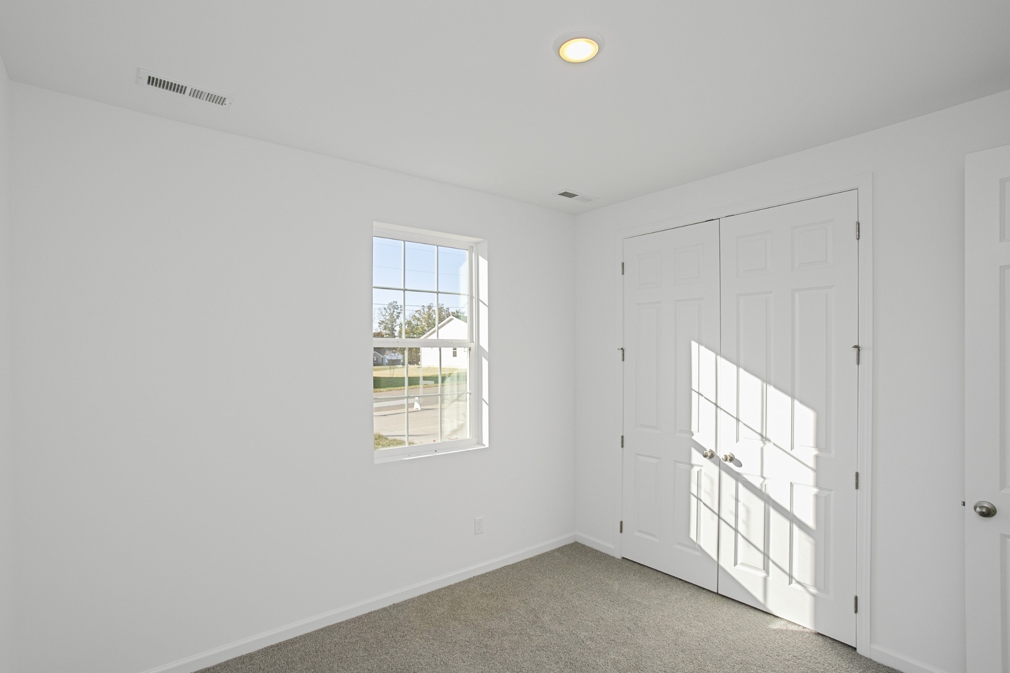 702 West Chestnut Street Dickson, TN 37055 - Photo 4 of 37 a view of an empty room with a window