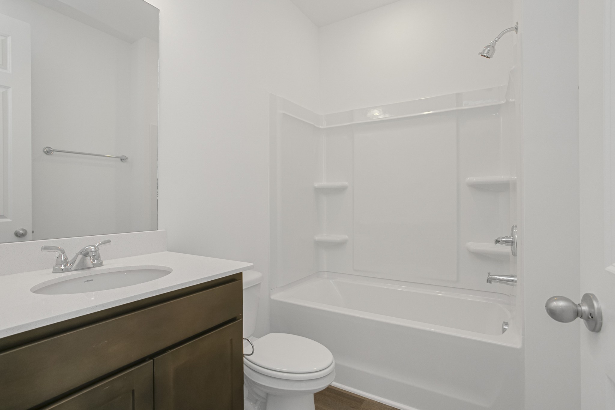 702 West Chestnut Street Dickson, TN 37055 - Photo 6 of 37 a bathroom with a sink toilet vanity and bathtub