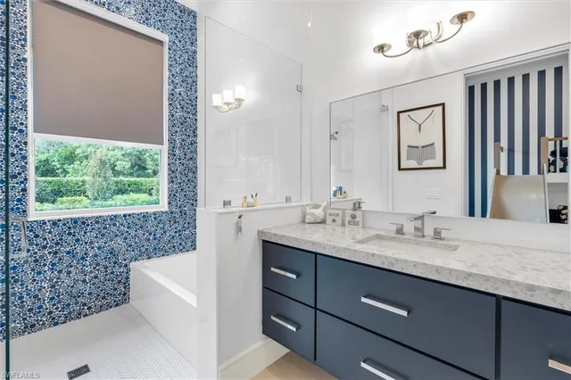 a spacious bedroom with a large bed and a couch