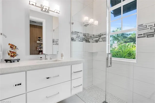a kitchen with a refrigerator and a stove top oven