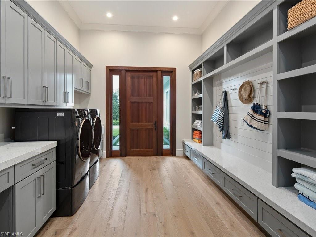 830 Cassena Road Naples, FL 34108 - Photo 25 of 41 a kitchen with a refrigerator and a stove top oven