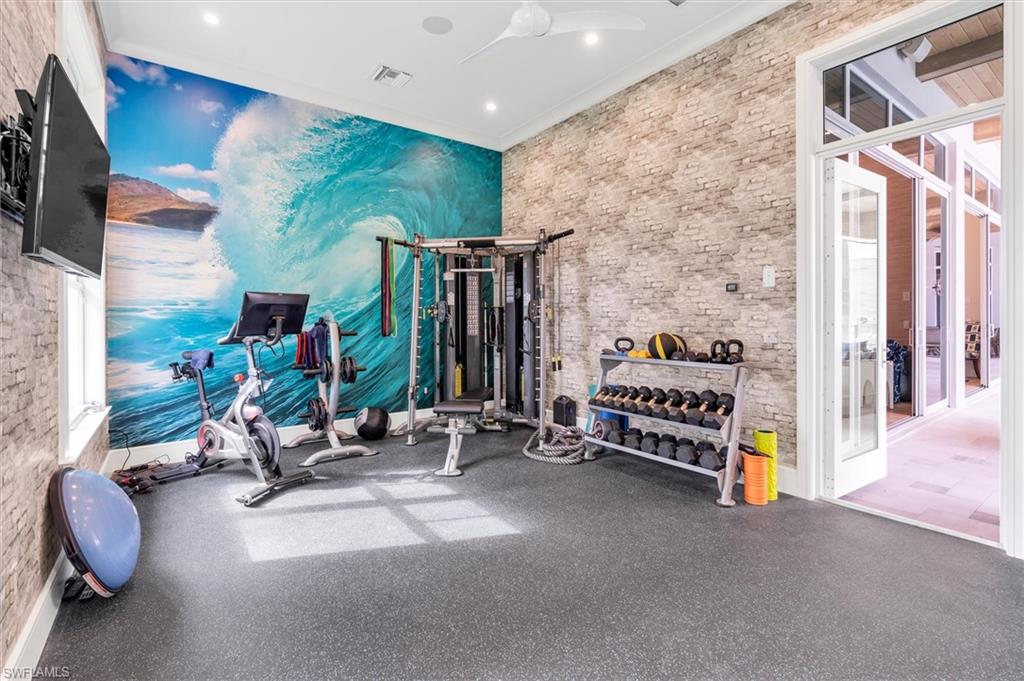 830 Cassena Road Naples, FL 34108 - Photo 26 of 41 a view of game room with gym equipment