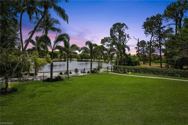 a front view of house and yard with green space