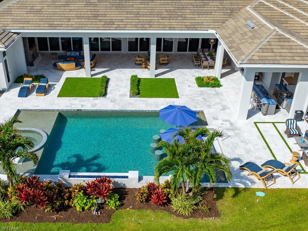 830 Cassena Road Naples, FL 34108 - Photo 41 of 41 an aerial view of a house with swimming pool and porch