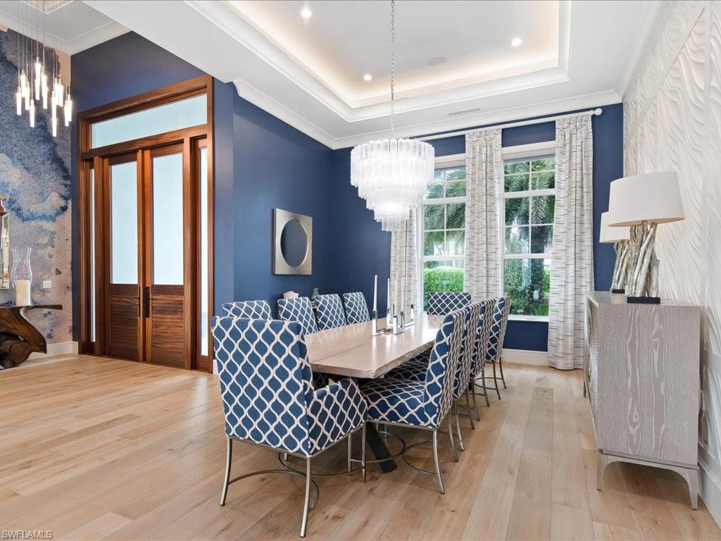 830 Cassena Road Naples, FL 34108 - Photo 5 of 41 a dining room with furniture window and wooden floor