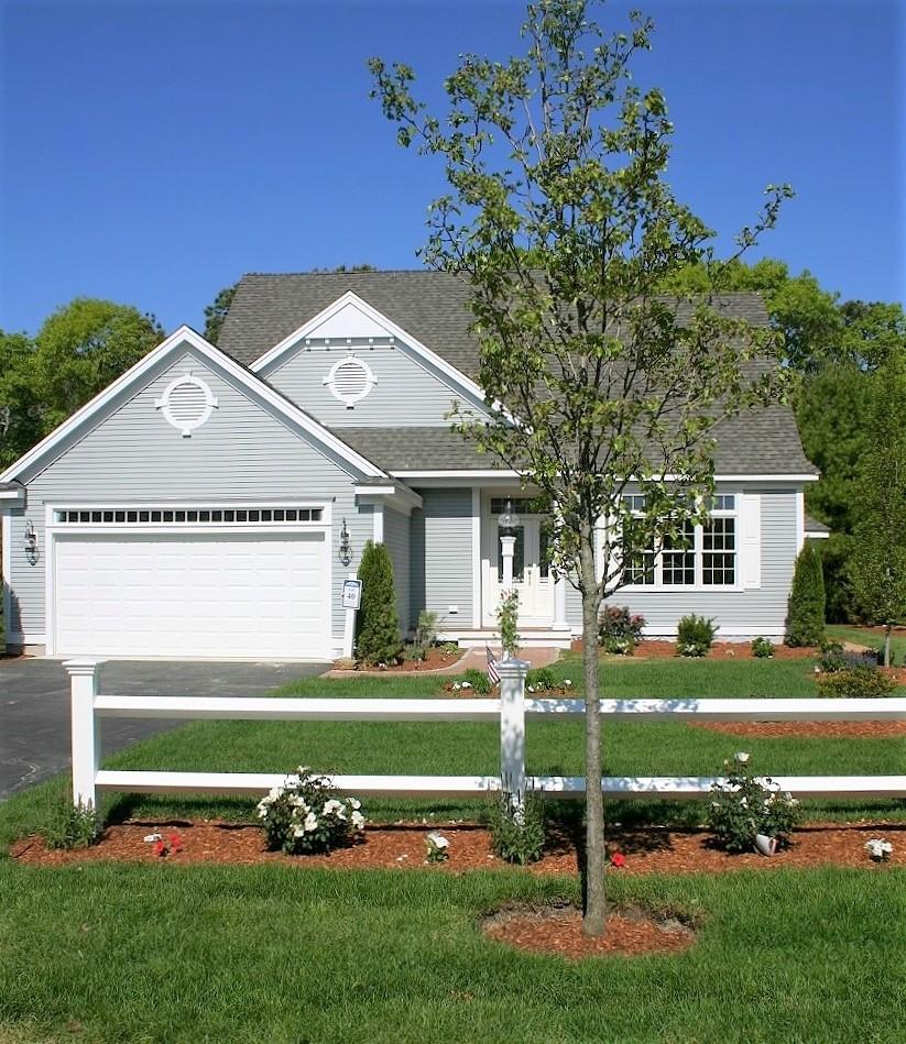 61 Blue Castle Drive Mashpee, MA 02649 - Photo 23 of 28 a front view of a house with a garden