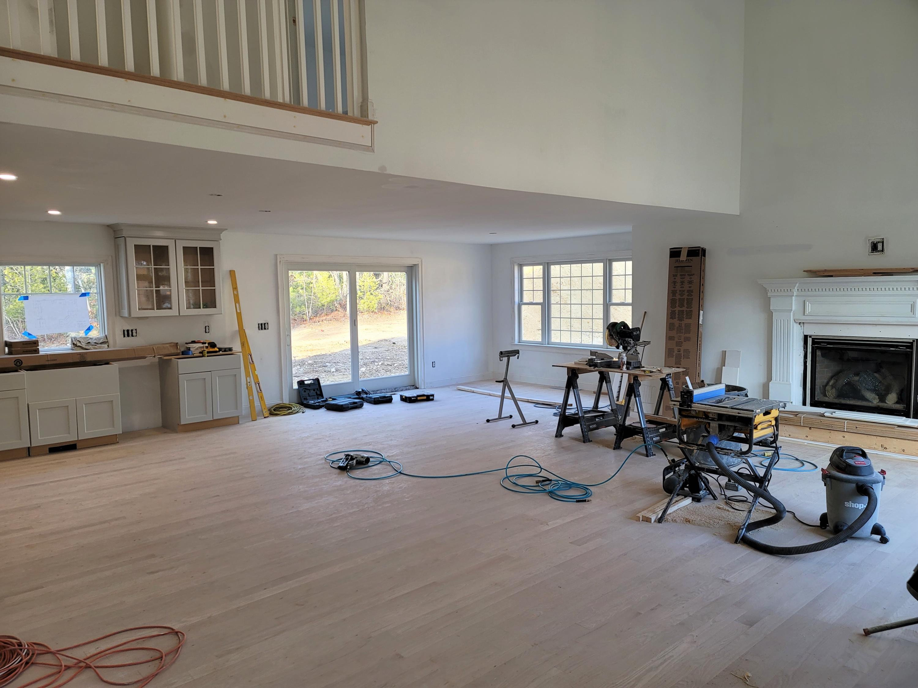 61 Blue Castle Drive Mashpee, MA 02649 - Photo 4 of 28 a living room with furniture and a fireplace