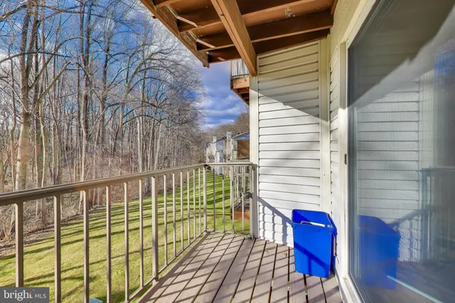 a view of a balcony with chairs