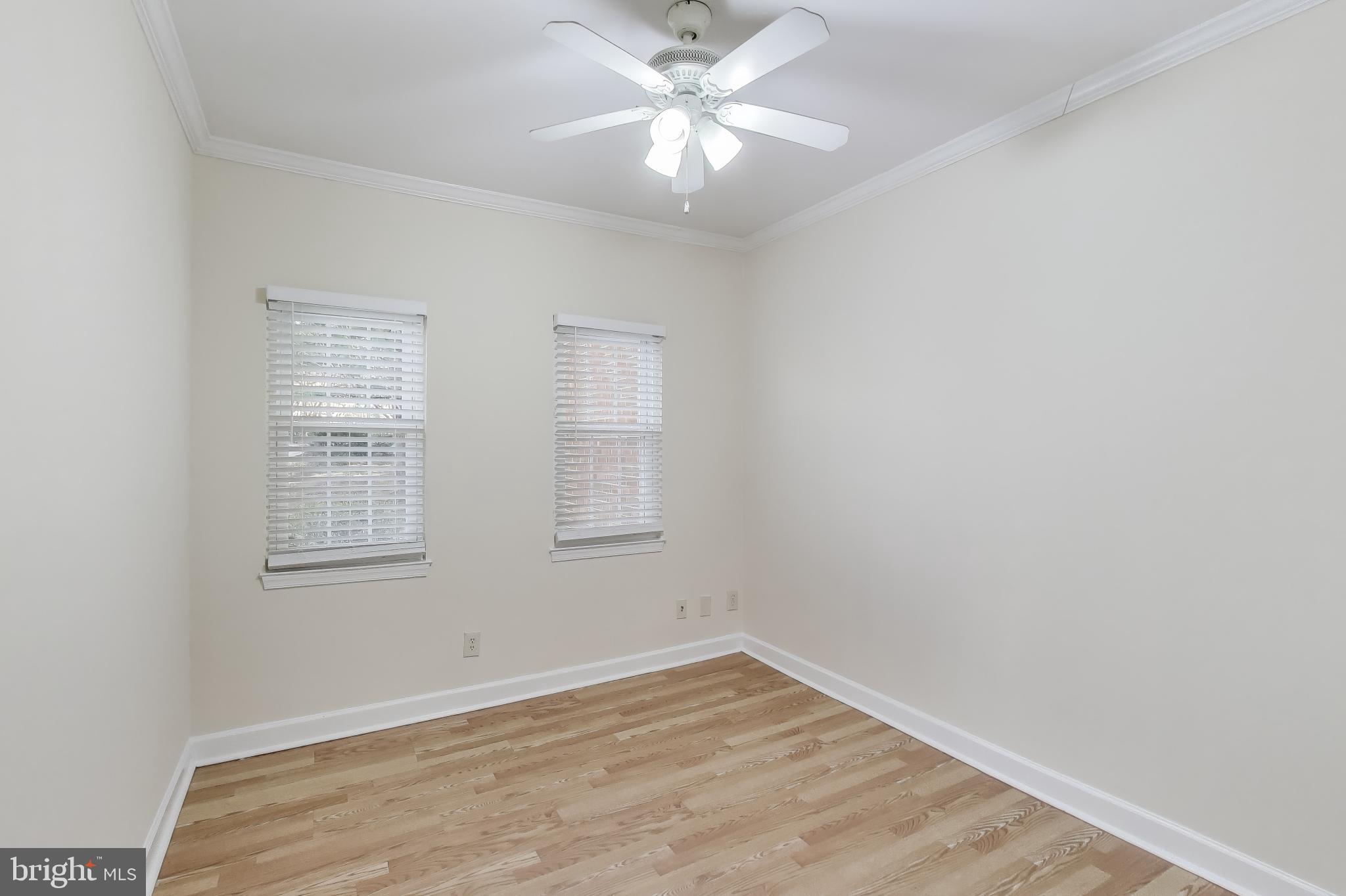 10408 Parthenon Court, Unit 10408 Bethesda, MD 20817 - Photo 22 of 34 an empty room with a window and a fan