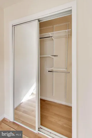a kitchen with stainless steel appliances granite countertop a sink and a refrigerator