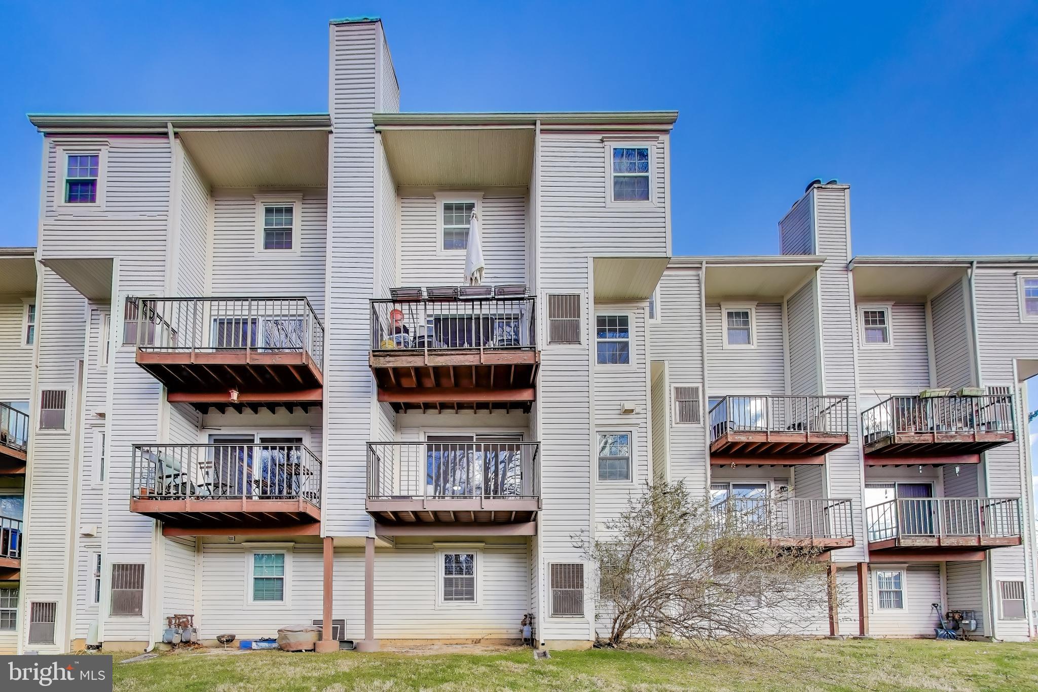 10408 Parthenon Court, Unit 10408 Bethesda, MD 20817 - Photo 9 of 34 a front view of a building with balcony