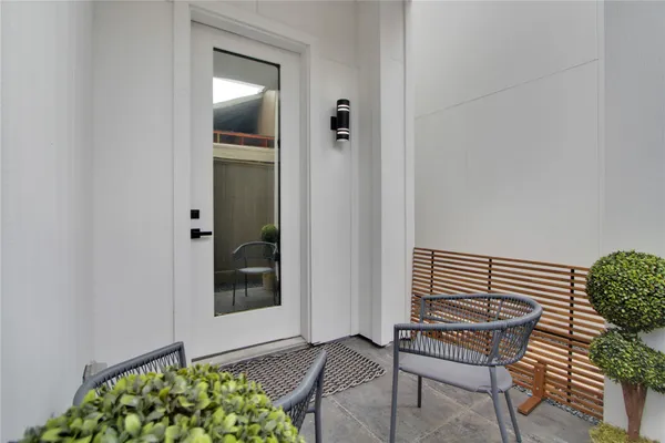 a view of room with window and wooden floor