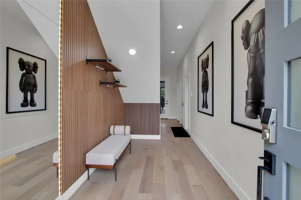 a view of a hallway with seating area