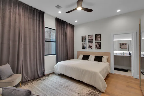 a bedroom with a large bed and a couch