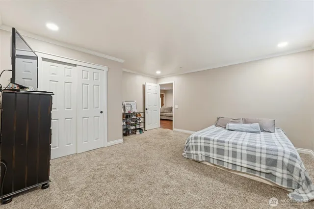 a bedroom with a bed and cabinets