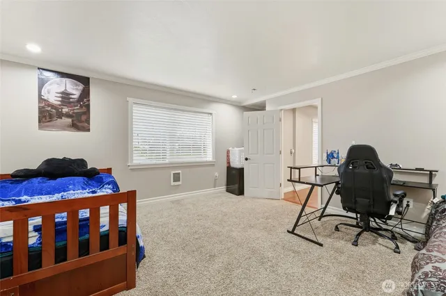 a bedroom with furniture and a window