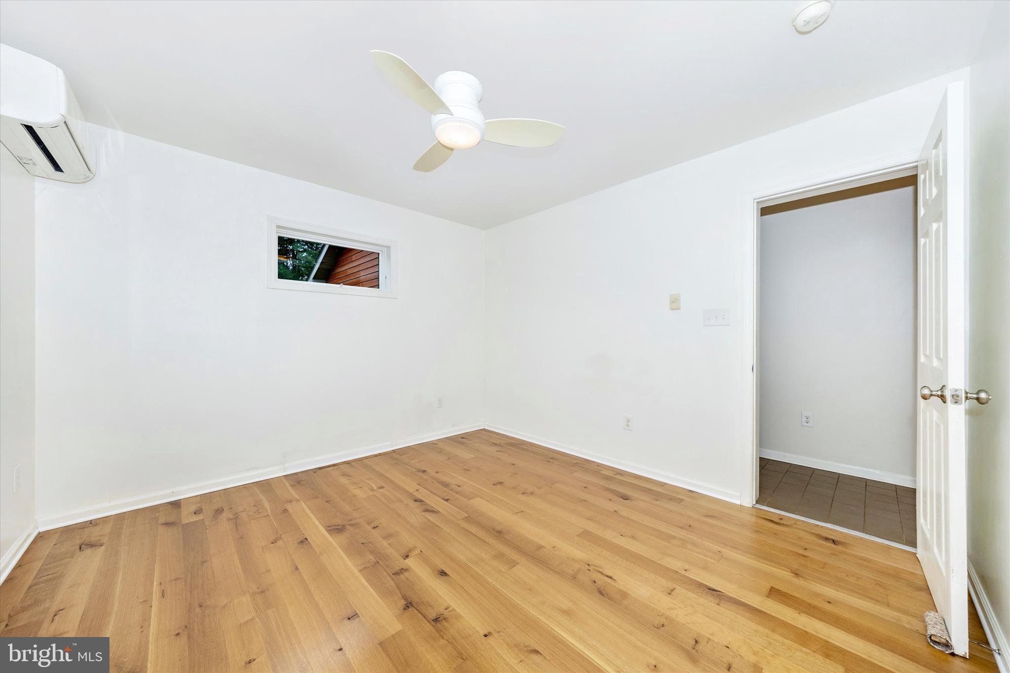 9930 Woodsboro Road Frederick, MD 21701 - Photo 20 of 58 a view of empty room with wooden floor