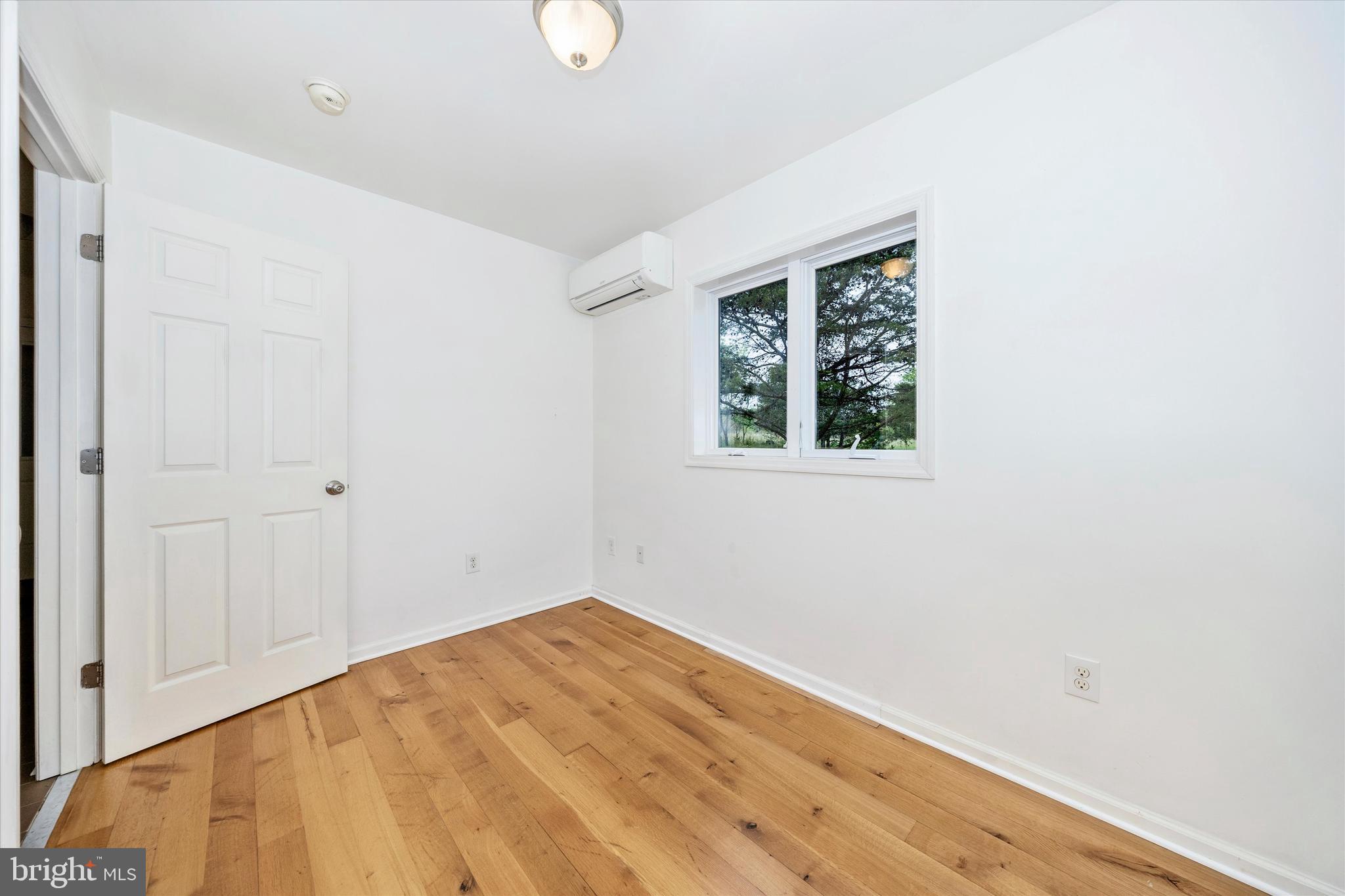 9930 Woodsboro Road Frederick, MD 21701 - Photo 27 of 58 a view of empty room with wooden floor